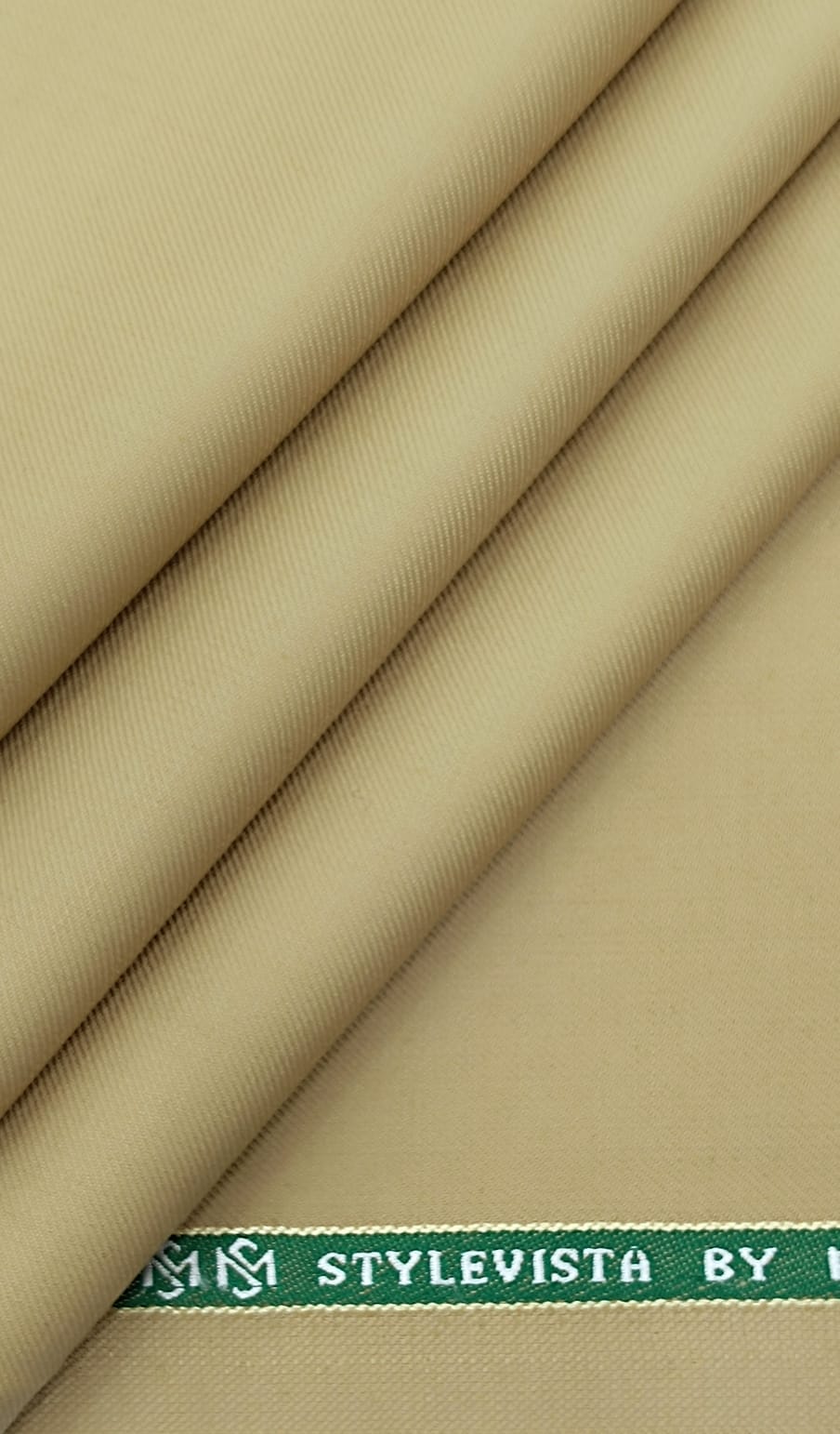 Real photograph of beige Super 100s fine wool blend suiting cloth from the Mittal & Sons shelves