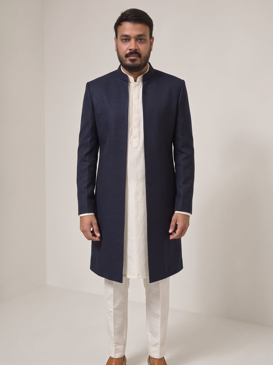 Nitesh Mittal in an open midnight-navy long jacket over an ivory kurta