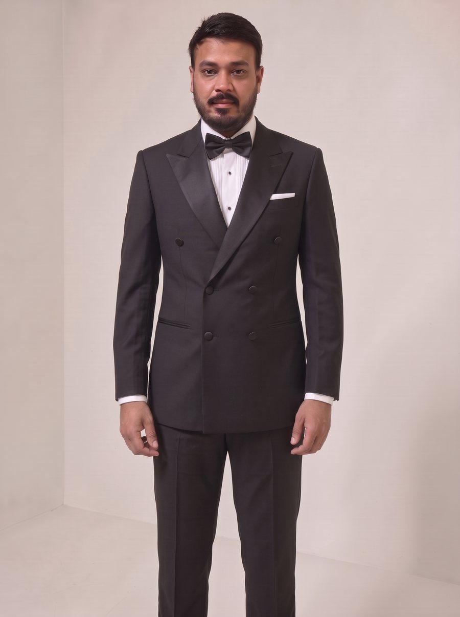 Nitesh Mittal in a black double-breasted peak-lapel tuxedo
