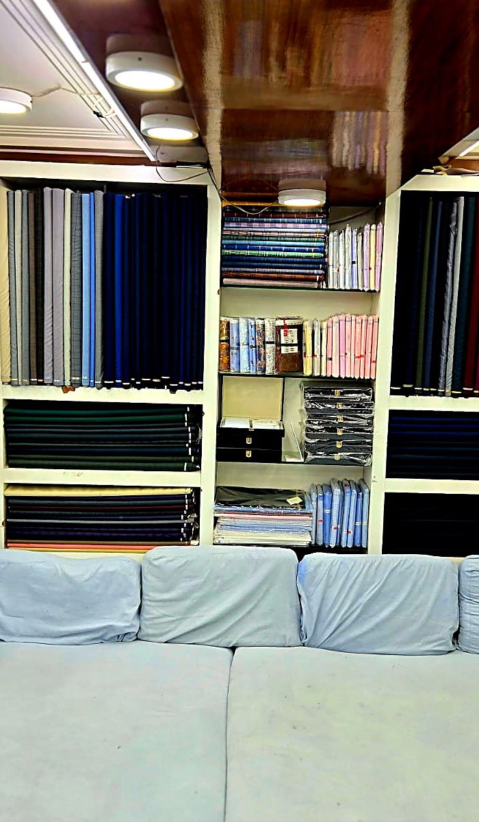 Suiting and shirting stacked on the shelves at Mittal & Sons, Chandni Chowk